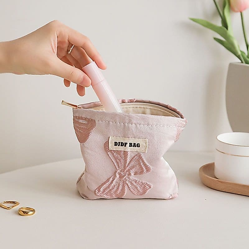 Influenciador mesmo estilo Mini flor rosa arco pequeno saco cosmético feminino portátil bolsa de moedas lona batom saco