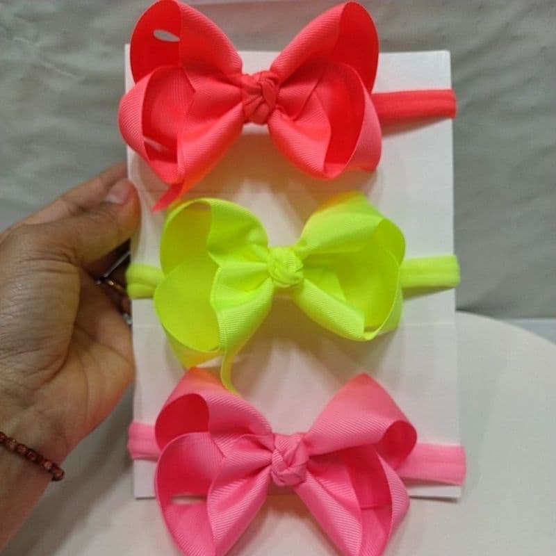 Faixinha/ Laço infantil na faixinha/Laço boutique neon aberto com ponta.