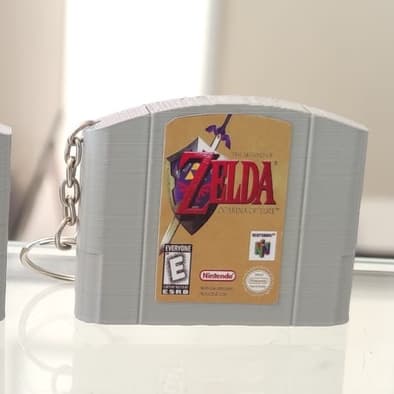 Chaveiro Gamer Retrô – Fita Mini Nintendo 64 com Jogos Clássicos