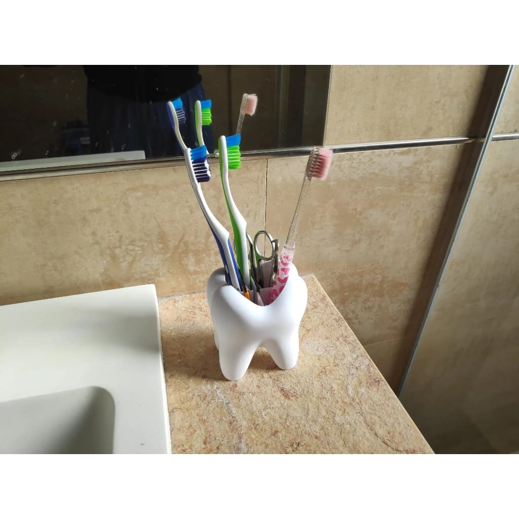 Porta escova de dente em formato de dente