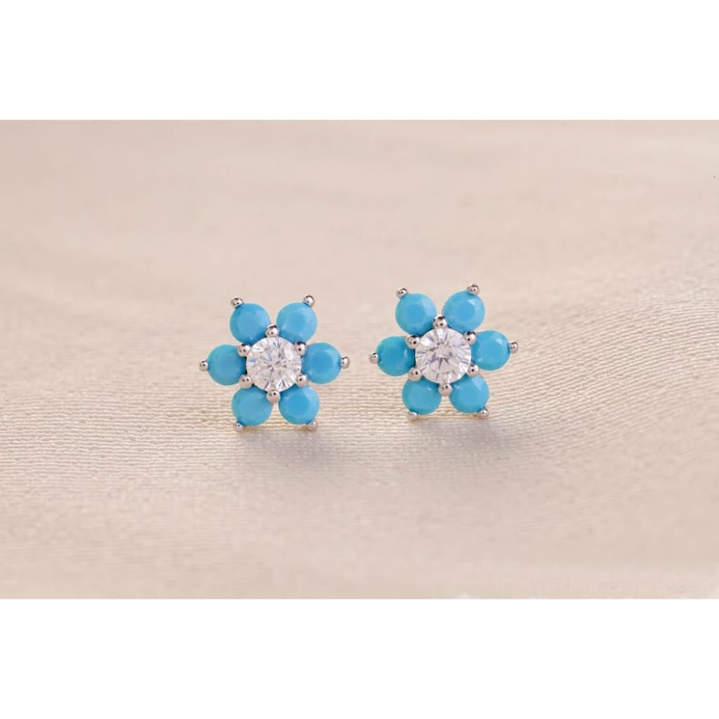 BRINCO FLOR 6 PETALAS AZUL TURQUESA PONTO DE LUZ NO MEIO