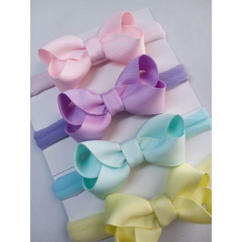 Faixinha de bebê kit com quatro laços de bebê