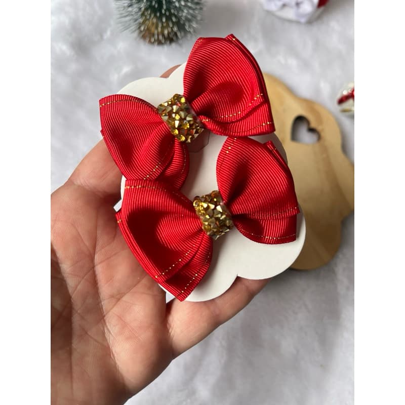 Par de laços vermelho com dourado