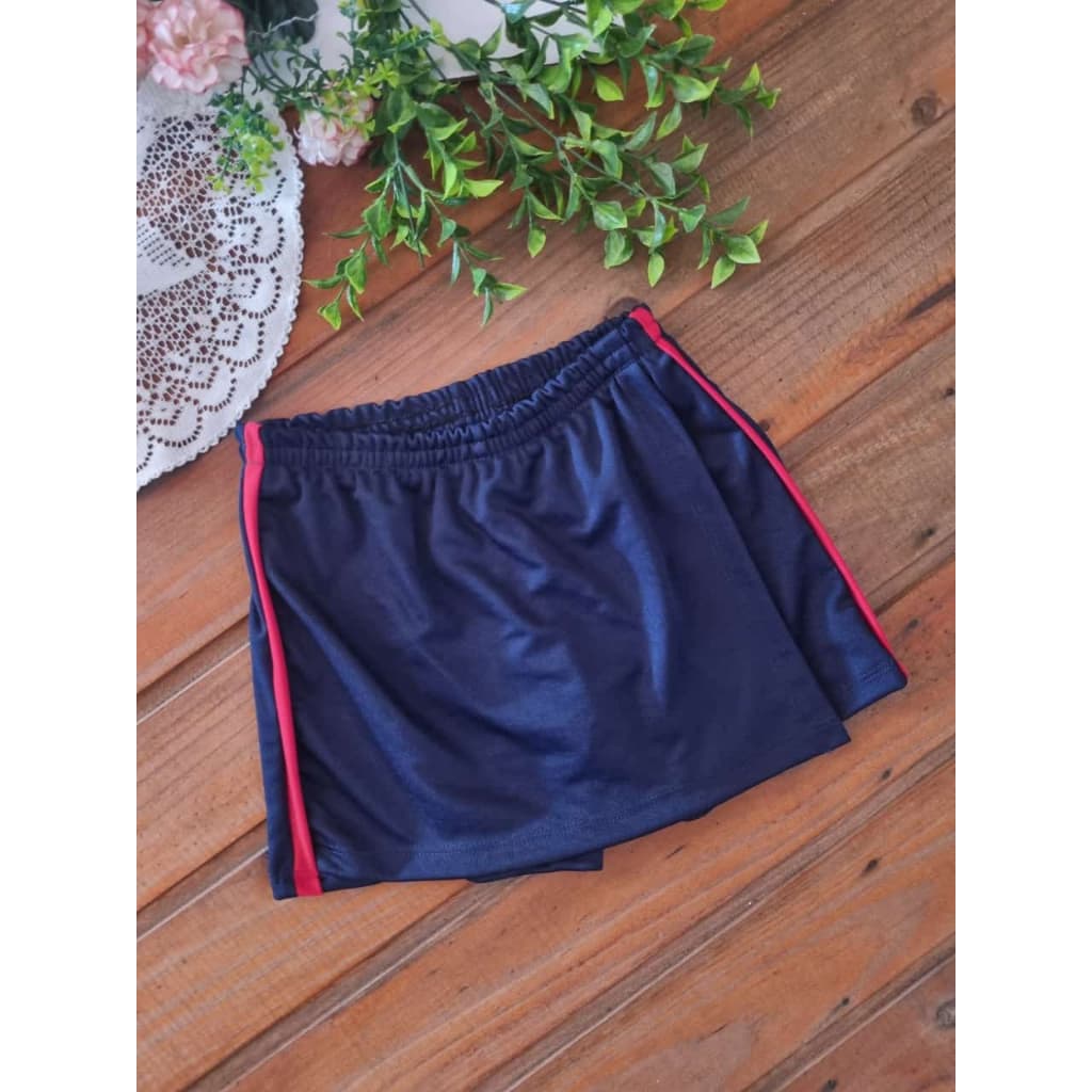 Schort saia escolar azul marinho com frizo vermelho. Infantil, juvenil e adulto.