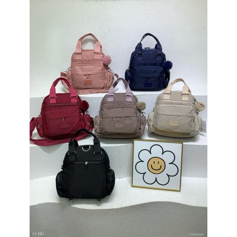 bolsa feminina media nylon material impermeável, vira mochila e transversal de ombro. OK