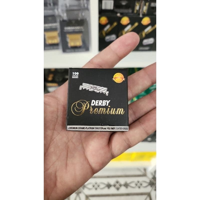 Lâmina Derby Premium caixa c/100 Bandas cortadas.