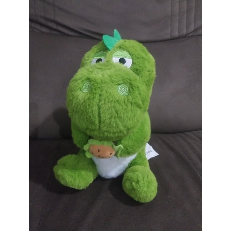 Brinquedo Pelúcia Dinossauro Verde segurando lanche BR Machine