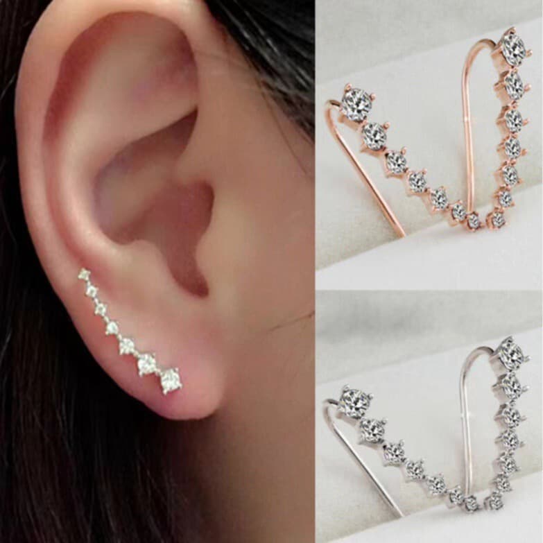 Brincos em formato de lagarta da Ursa Maior com um visual luxuoso e sofisticado, cravejados com diamantes e zircônias.