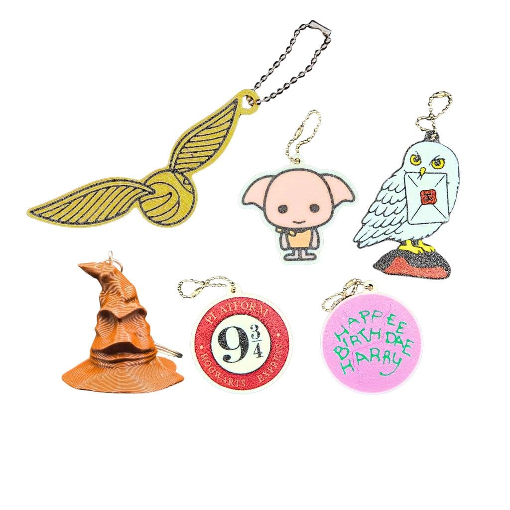 Chaveiros/Pingentes Harry Potter/ Edwiges/ Dobby/ Chapéu Seletor/ Pomo de Ouro/ Bolo/ Plataforma