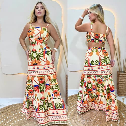 Vestido longo tropical com estampa vibrante, tecido leve e caimento perfeito. Ideal para verão, praia e casuais