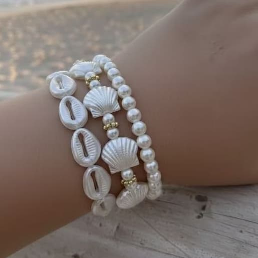 Kit 3 pulseiras pérolas conchas mar búzios praia verão 2026