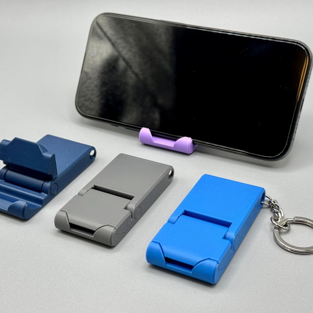 Suporte Celular Chaveiro Dobrável De Mesa Para Vídeos Reunião Estudo Smartphone Home Office