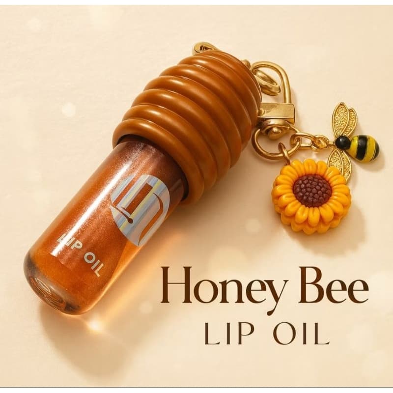 Gloss Labial Lip Oil Miss Glam Honey Mel Hidratante com Chaveiro Girassol – Brilho Natural e Lábios Macios