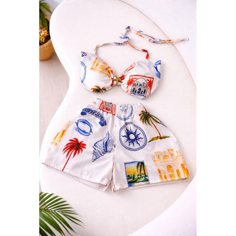 Conjunto tropical com top frente única e shorts cintura alta. Leve, confortável e ideal para looks de verão e resort
