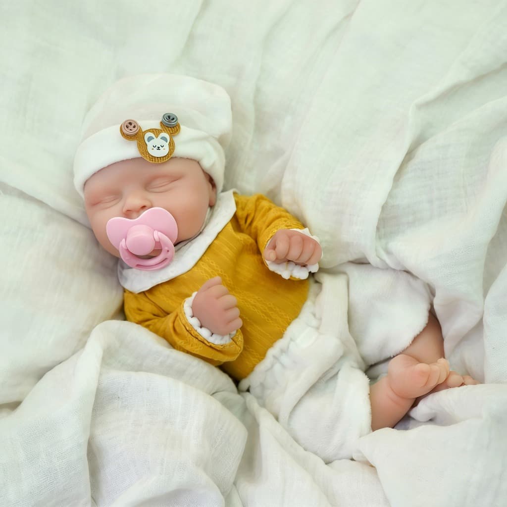 Bebê Reborn 35cm Silicone Solido Boneca Menina Olho fechado Macio e Fofo com Acessórios