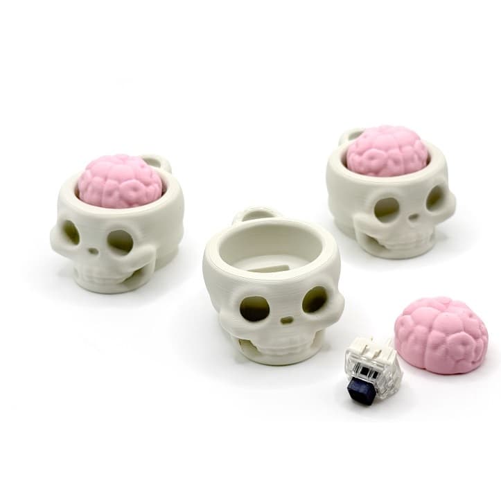 Chaveiro clicker anti stress ansiedade formato caveira caveirinha