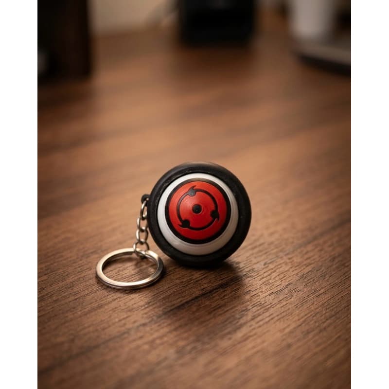 Chaveiro Sharingan Fidget Toy - Olho Giratório Antiestresse Premium