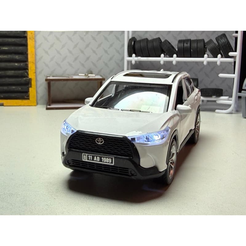 Miniatura Toyota corolla Cross 1/32 som e luz