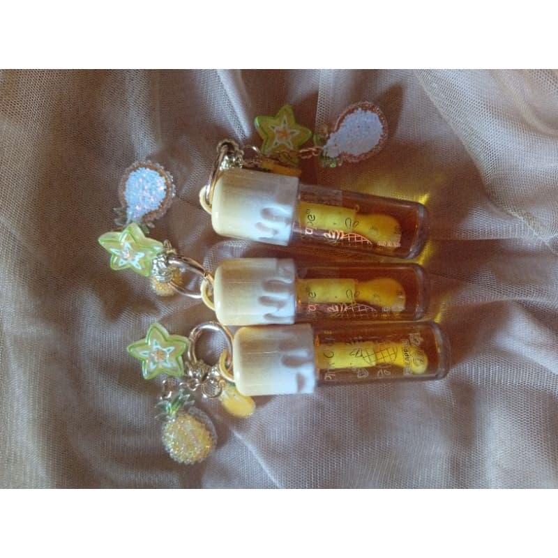 Lip gloss abacaxi com chaveiro