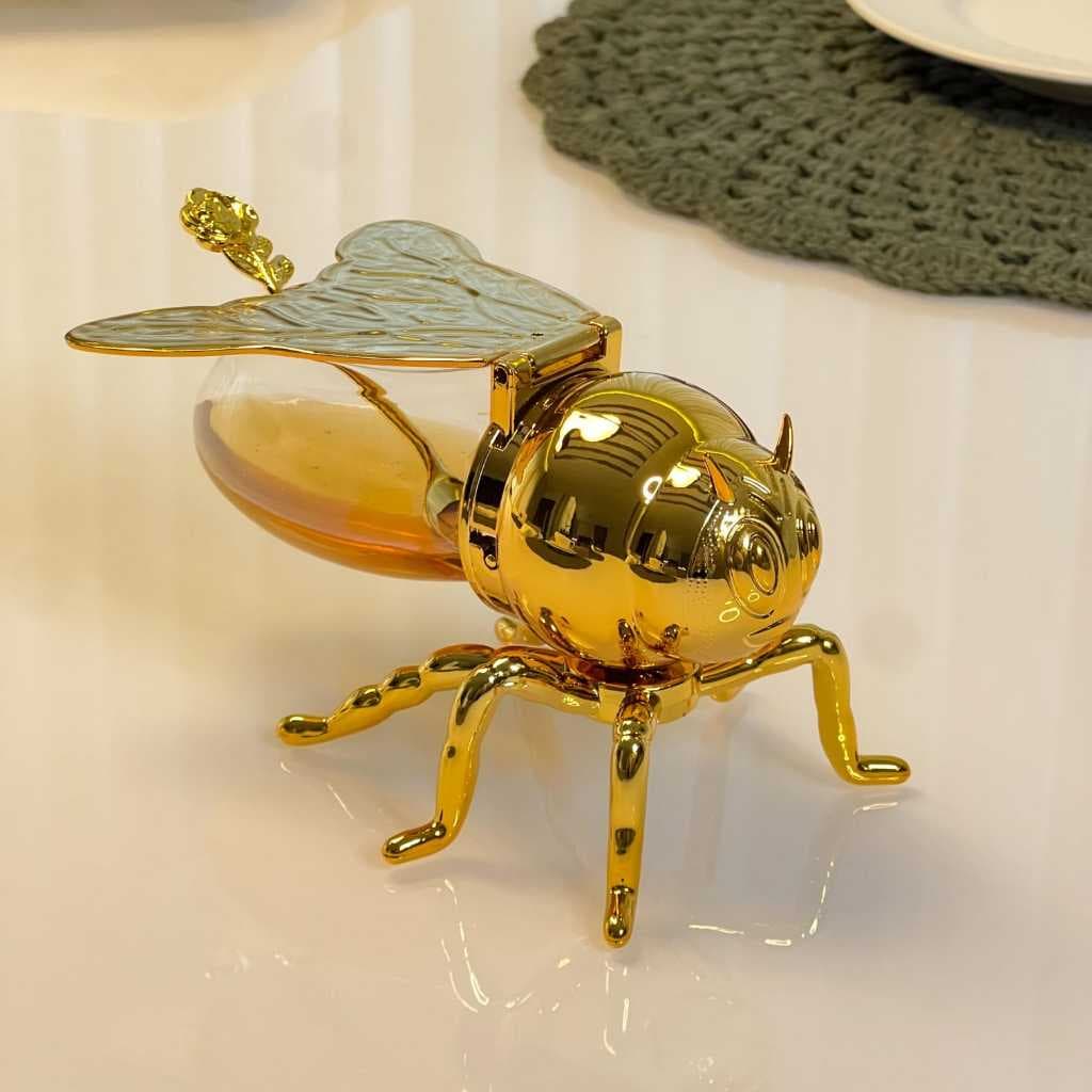 Meleira formato abelha, plástico, dourado, com colher, capacidade de mel 120ml, elegante e funcional