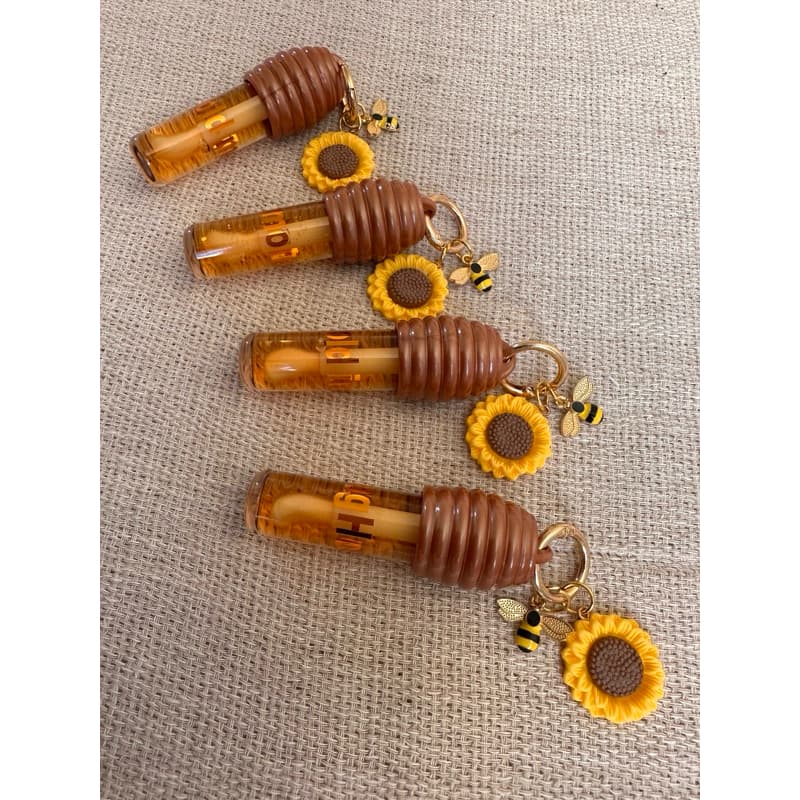 Lip Gloss Mel com chaveiro de Girassol 🍯 🌻