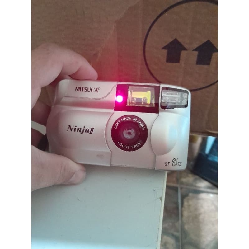Câmera Fotográfica Analógica Mitsuca Ninja II com Capa Com Defeitos.
