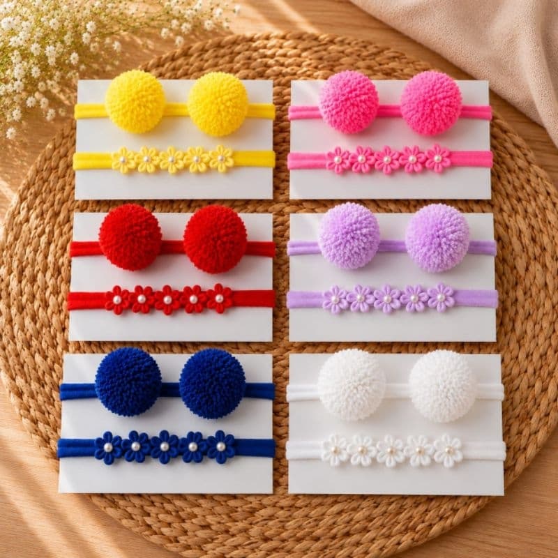 Faixinha de pompom infantil