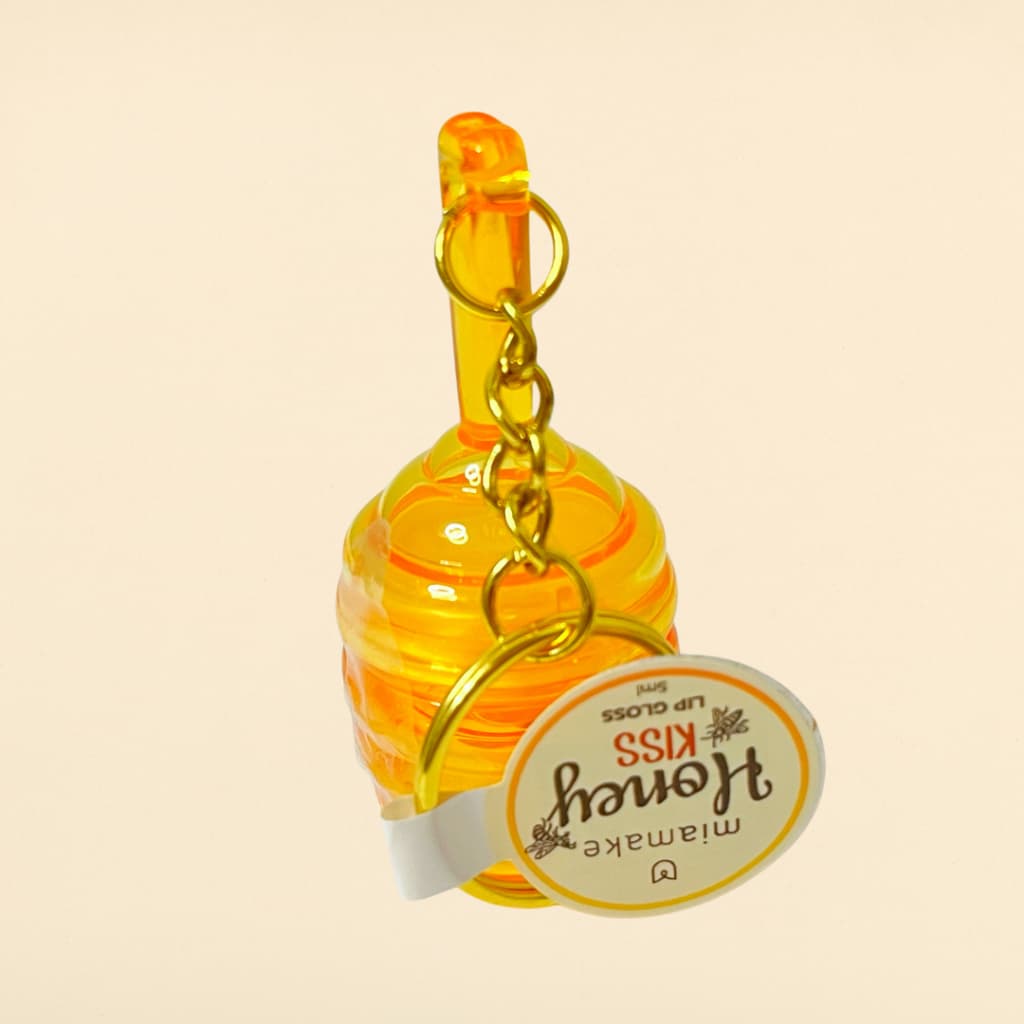 Lip Gloss Honey Kiss Mia Make com Chaveiro 5ml – Hidratante, Brilho Intenso, Efeito Espelhado