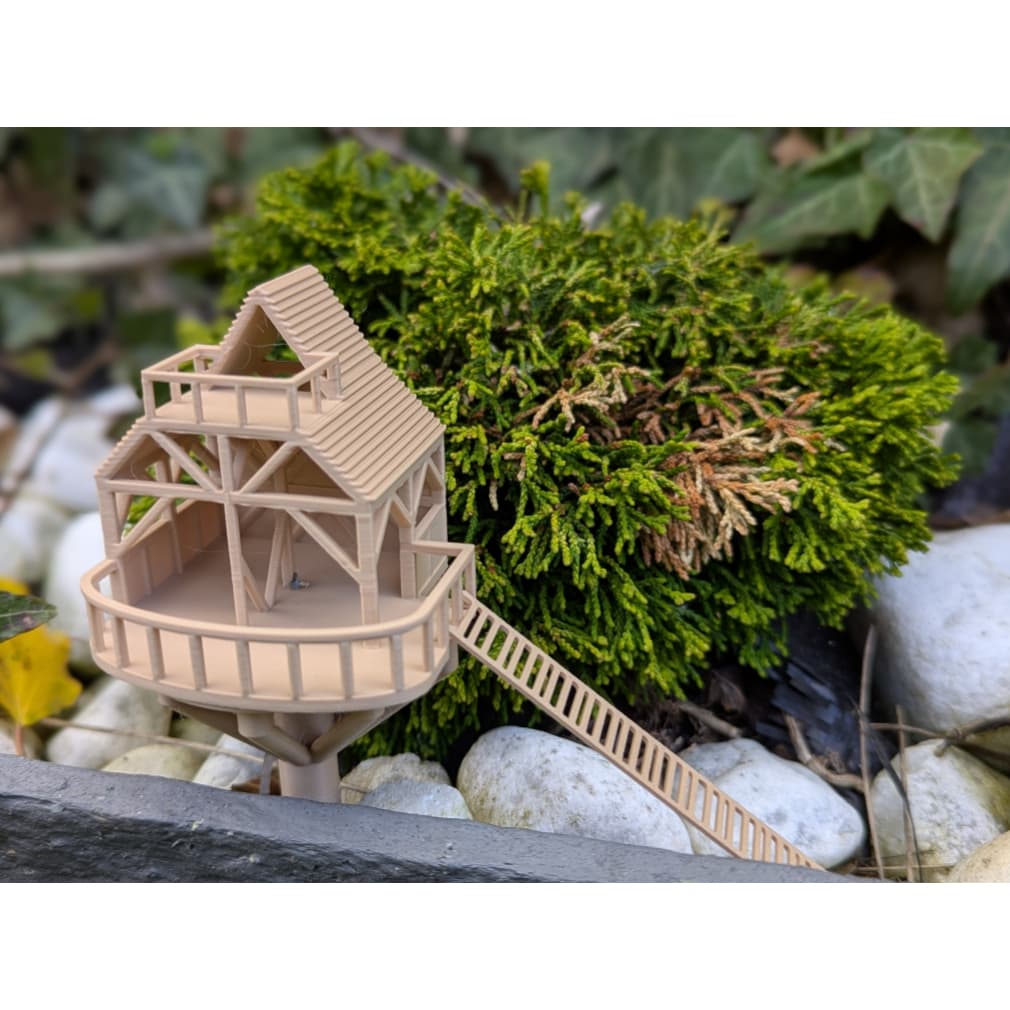 Mini casa na árvore-vaso
