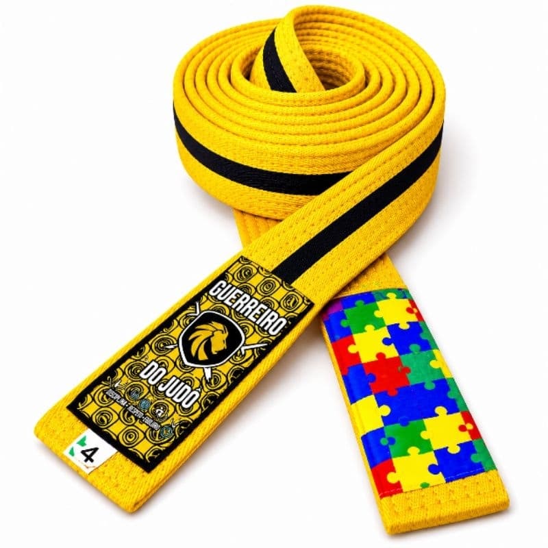 Faixa amarela de jiu-jitsu com viés preto tarja autismo