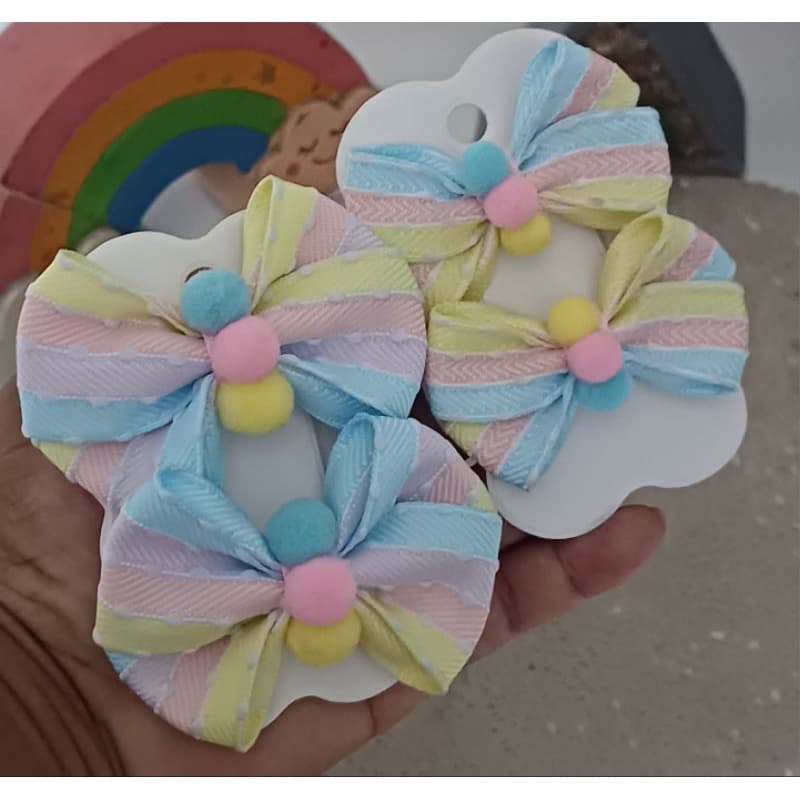 par de laço candy color com pompons coloridos tema circo rosa