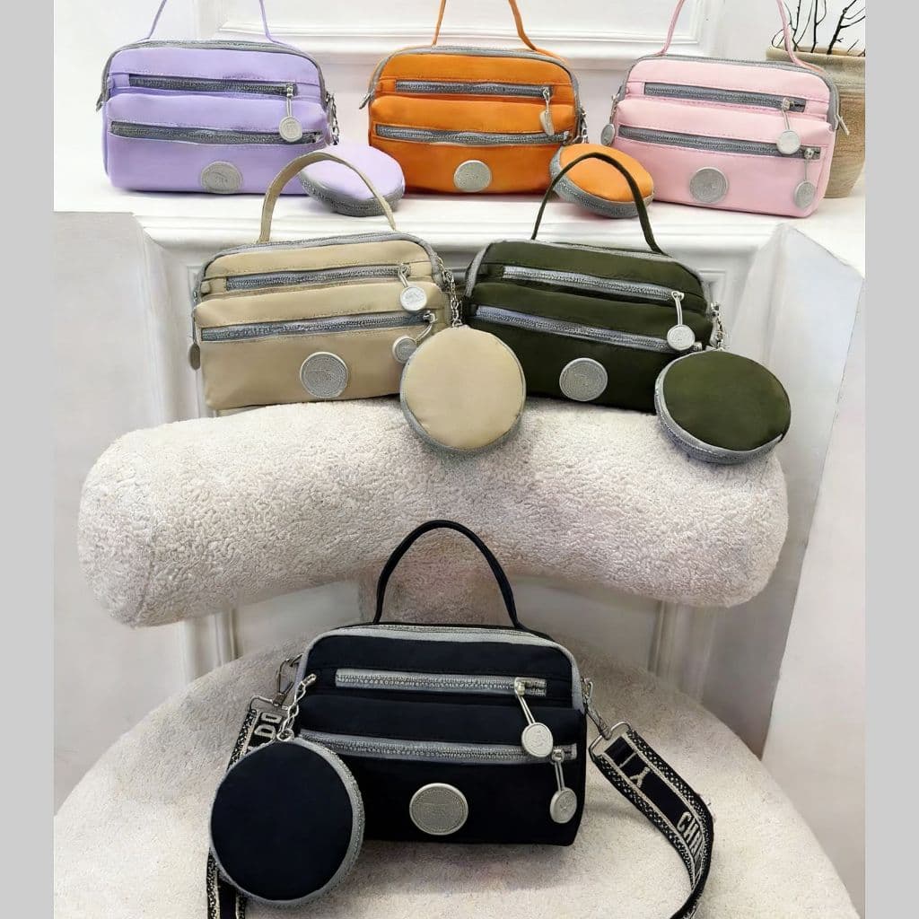 Bolsa Impermeável transversal feminina de tamanho médio com alça e porta-moedas.