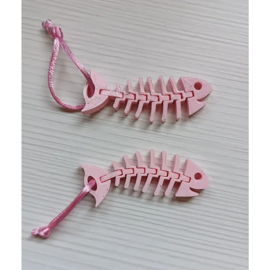 Chaveiro Articulado Esqueleto de Peixe – Estilo e Diversão no Seu Bolso!
