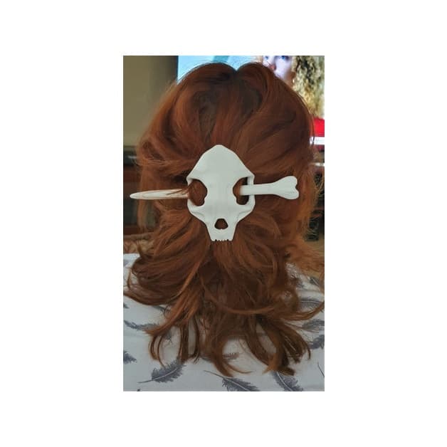 Prendedor de cabelo de caveira