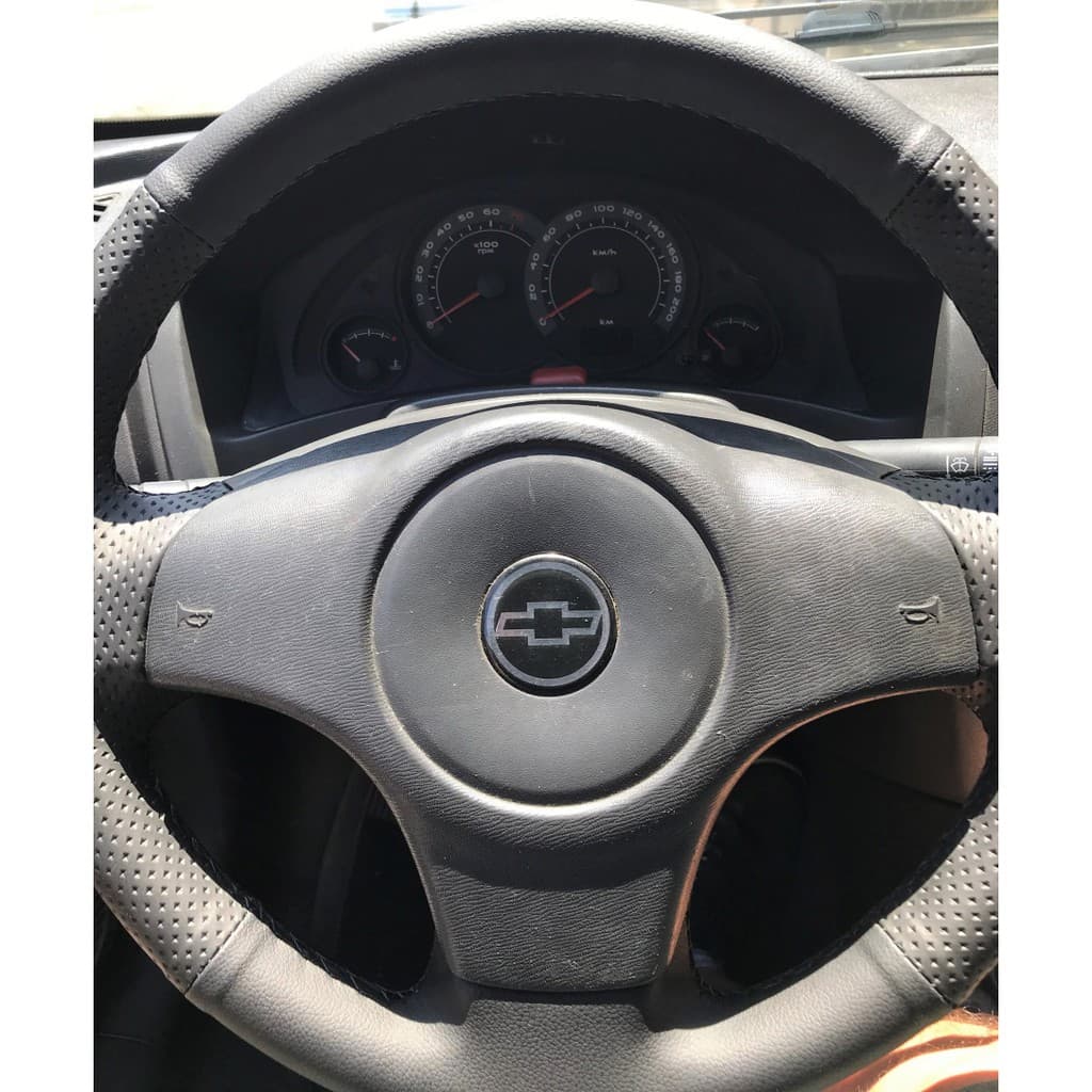 capa de volante costurada CELTA/PRISMA