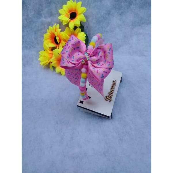 Tiara /Arco infantil com laço e mini pompom rosa azul branco e amarelo com laco de granulado/PASCOA COD15