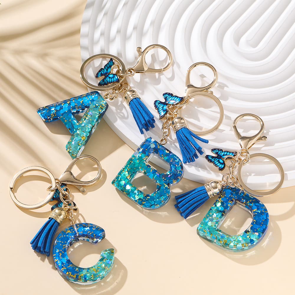 Chaveiro de Resina com Letras em Inglês, Pingente Borboleta Cristal Azul Real com Borla ✨🦋