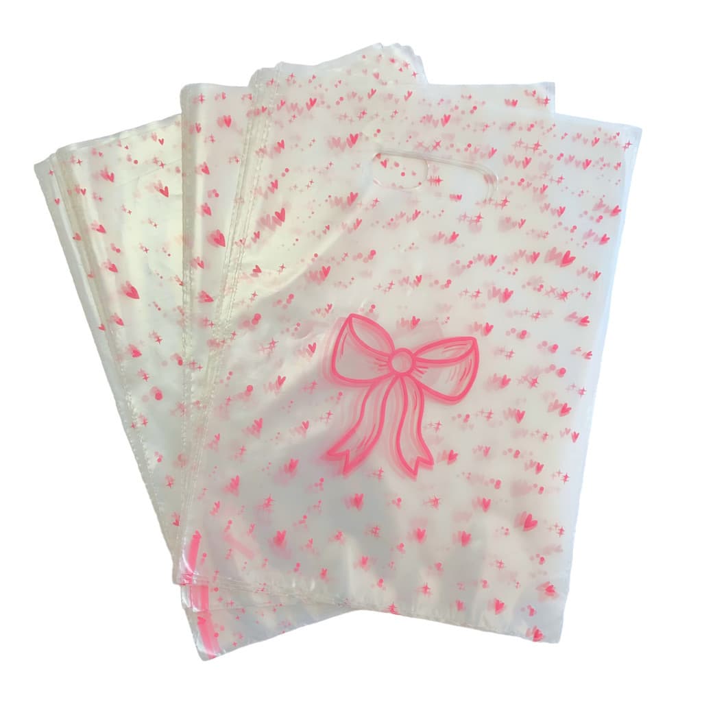 Sacola Boca de Palhaço Transparente Lacinho Rosa (35,5x25,5cm)