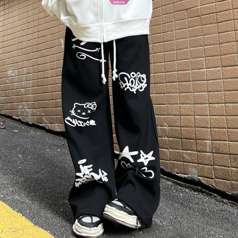 Sanrio Hello Kitty Calça Casual Preta Impressa 2024 Primavera/Verão Nova De Grafite Retro Solta Y2k Hip Hop Sweatpants