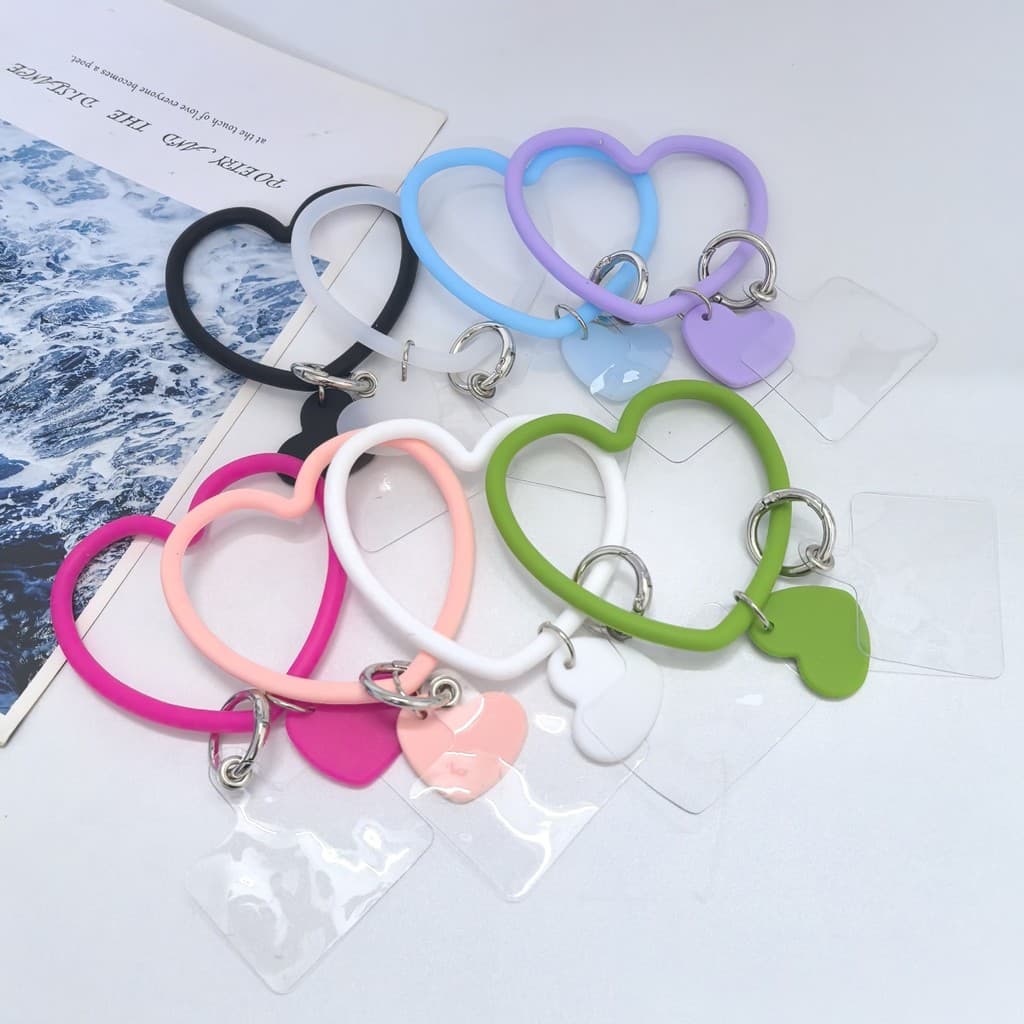 Kit 50/100 Pulseira De Silicone formato de coração Com Alça Antiperda Cordão/Chaveiro Para Celular envio aleatório