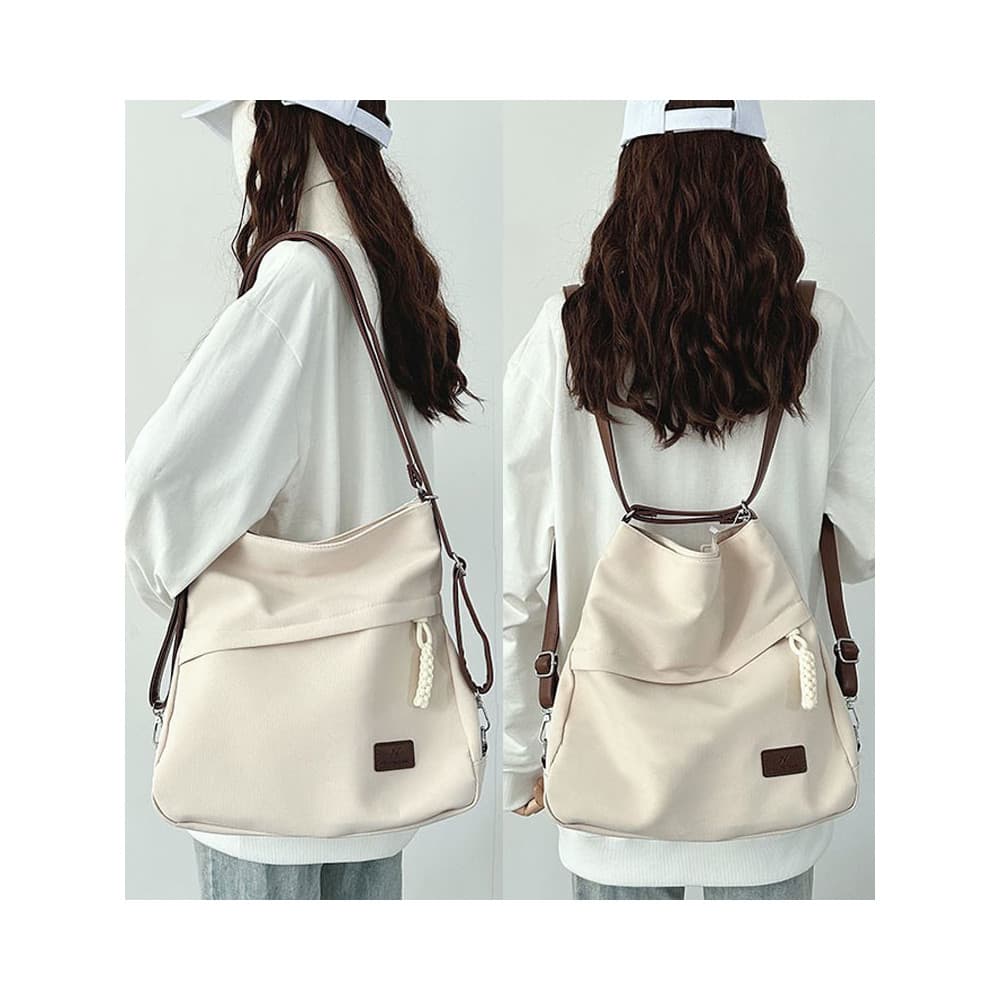 Um pacote de três propósitos mochila saco de escola estudante feminino 2026 novo estilo bolsa de lona grande capacidade