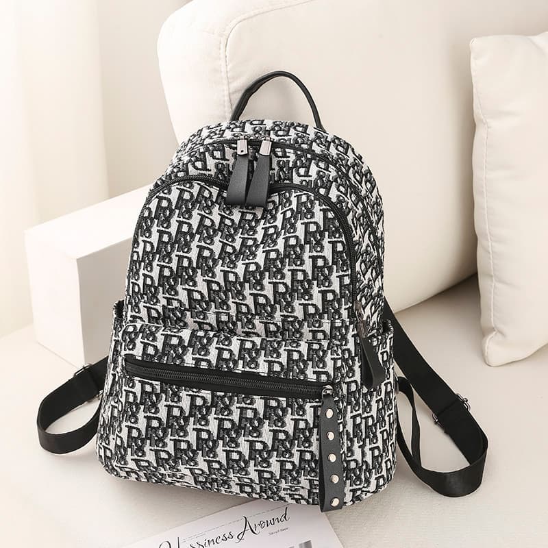 Mochila feminina 2025 novo estilo na moda moda nicho Design saco All-Match saco de escola grande capacidade lona mochila