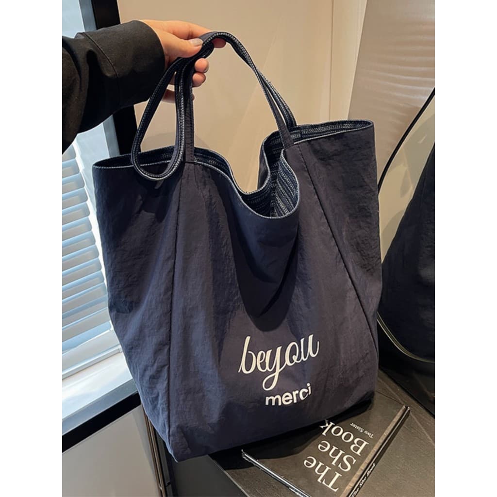 Bolsa de ombro de verão feminina bolsa de grande capacidade 2026 novo estilo Casual dupla face lona Commuter saco classe
