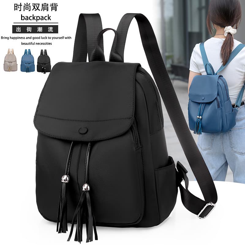 Oxford pano mochila feminina 2025 novo estilo versão coreana borla aba pequena mochila influenciador cor sólida leve moc