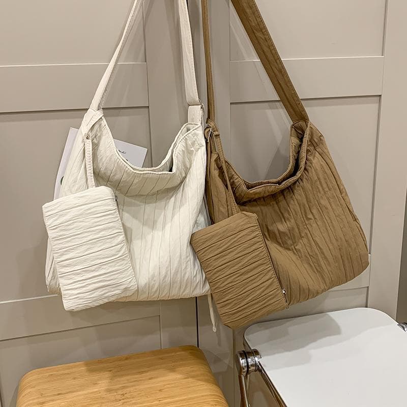 Bolsa de lona de grande capacidade feminina 2026 novo estilo bolsa Diagonal versão coreana bolsa mensageiro ombro enruga