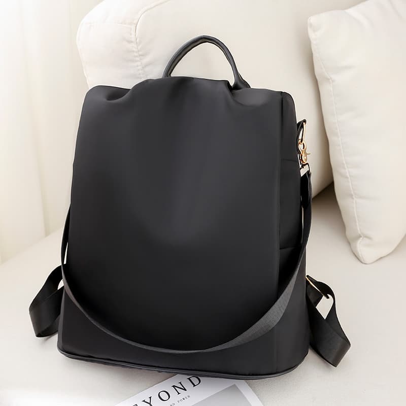 Mochila de náilon feminina 2025 novo estilo versão coreana All-Match lona saco de escola simples Oxford girando lazer mo