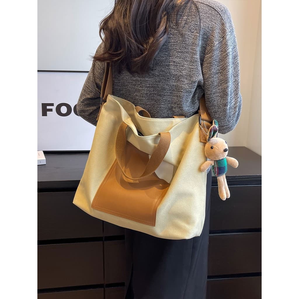 Bolsa de lona feminina grande capacidade estudante bolsa de ombro 2026 novo estilo classe sacola Cross-Body Commuter sac