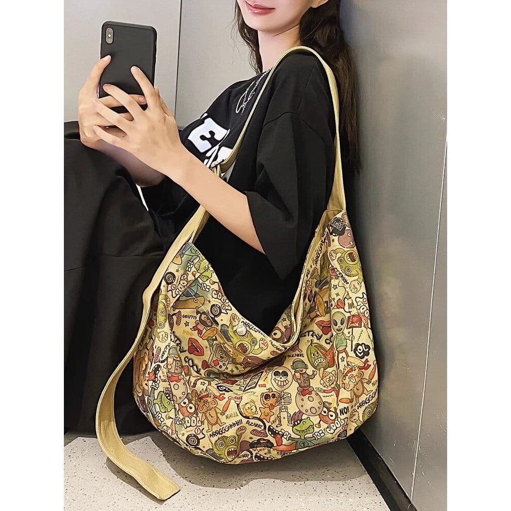 Nicho Graffiti bolsa de lona de grande capacidade feminina 2025 novo estilo moda bolsa mensageiro de um ombro Commuter c