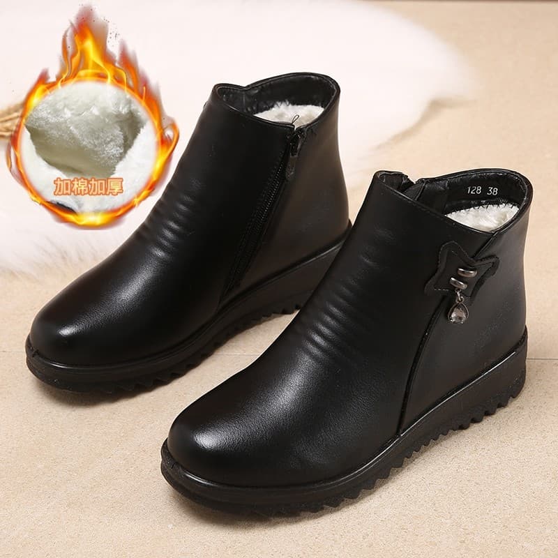 Sapatos mãe 2026 inverno velo-velo novas botas de meia-idade botas curtas de sola macia sapatos de couro plano sapatos d
