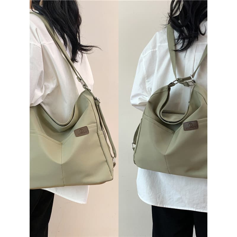 Mochila de três propósitos feminina 2026 novo estilo moda saco de grande capacidade de um ombro Commuter estudante unive